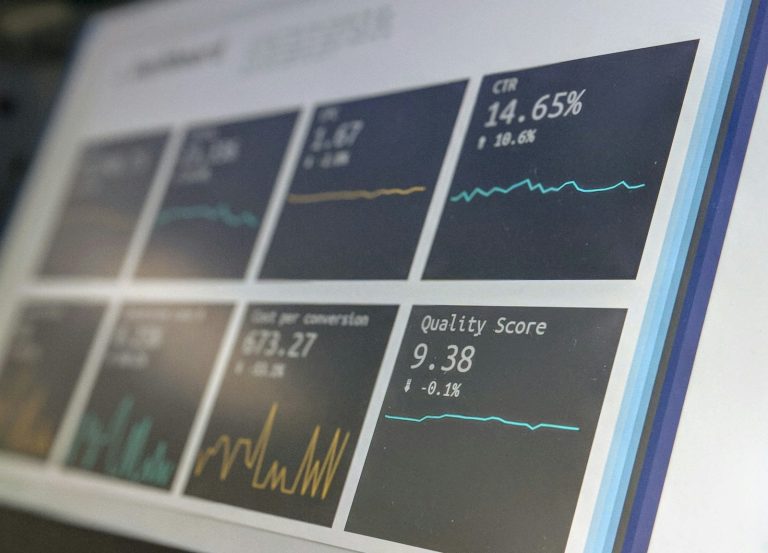 Custom CRM dashboard showing sales reports on a laptop